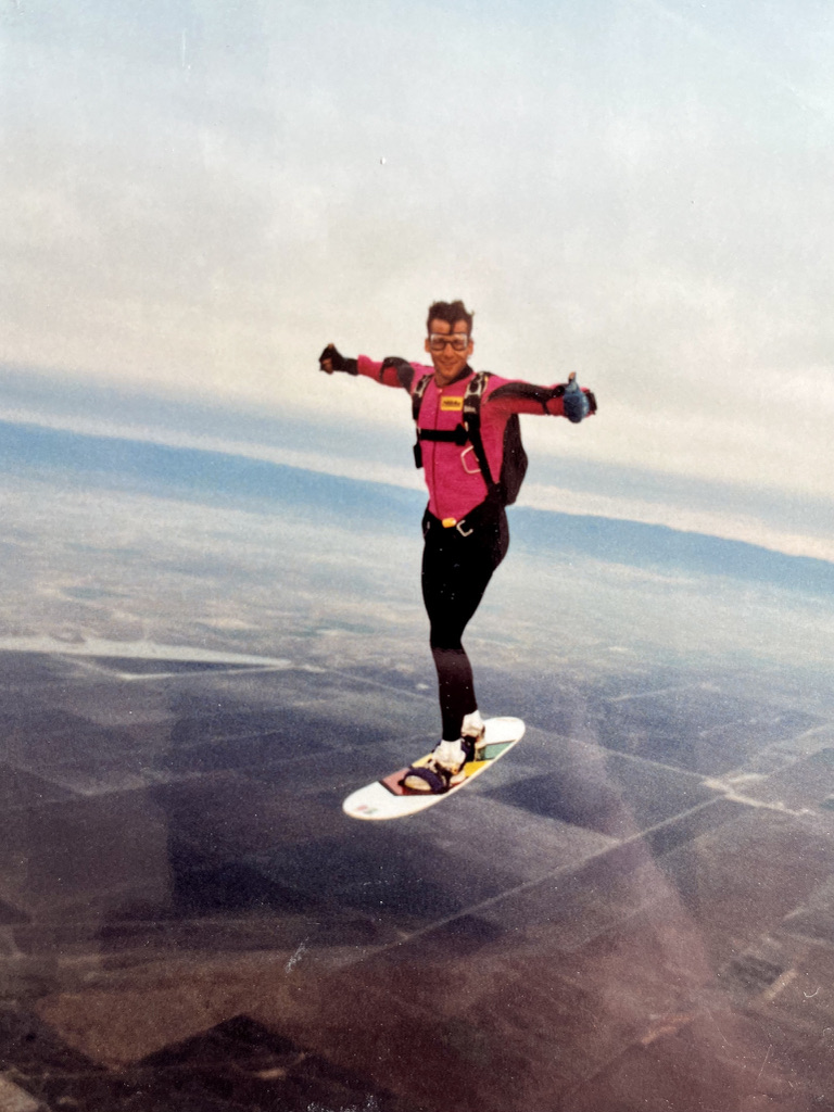 Dr. Bill Barber skysurfing high above the landscape